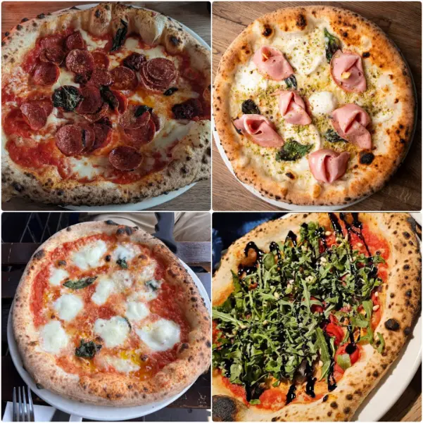 Neapolitan pizza with burrata, cherry tomatoes, and basil at Forno 500