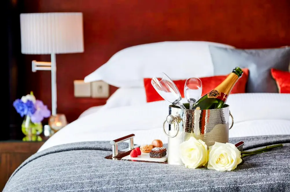 An image showing couple goals celebrating with a Champaign in a Best Hotel for Couples in Ireland.