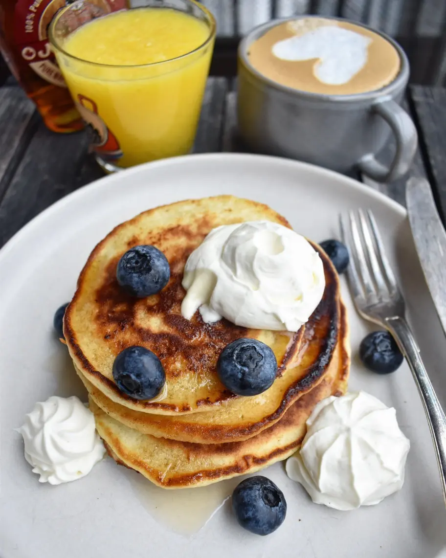 Best Pancakes with whipped cream and fresh raw blueberry toppings and cappuccino in Dublin
