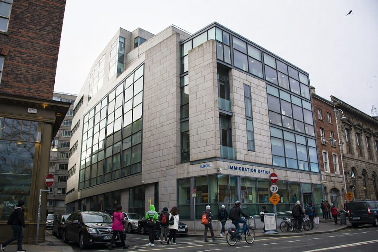 Burgh Quay immigration office Dublin building with people outside in city centre